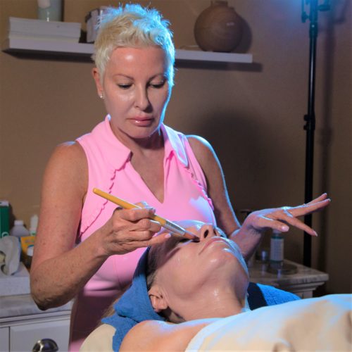 Medical Aesthetician Christina Smith, LME of Clevens Face & Body Specialists in Melbourne, Florida provides an anti-aging facial treatment for a patient.
